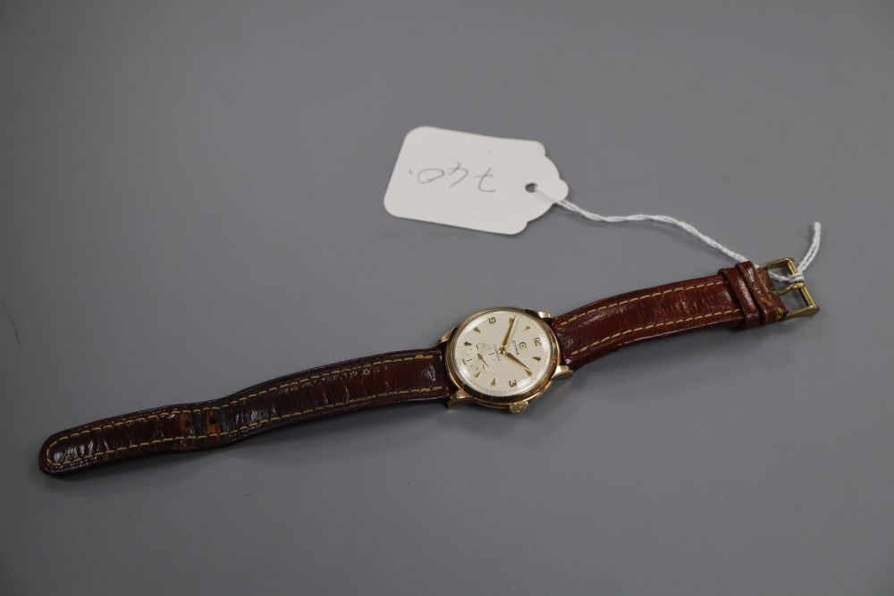 A gentlemans 1950s 9ct gold Cyma manual wind wrist watch